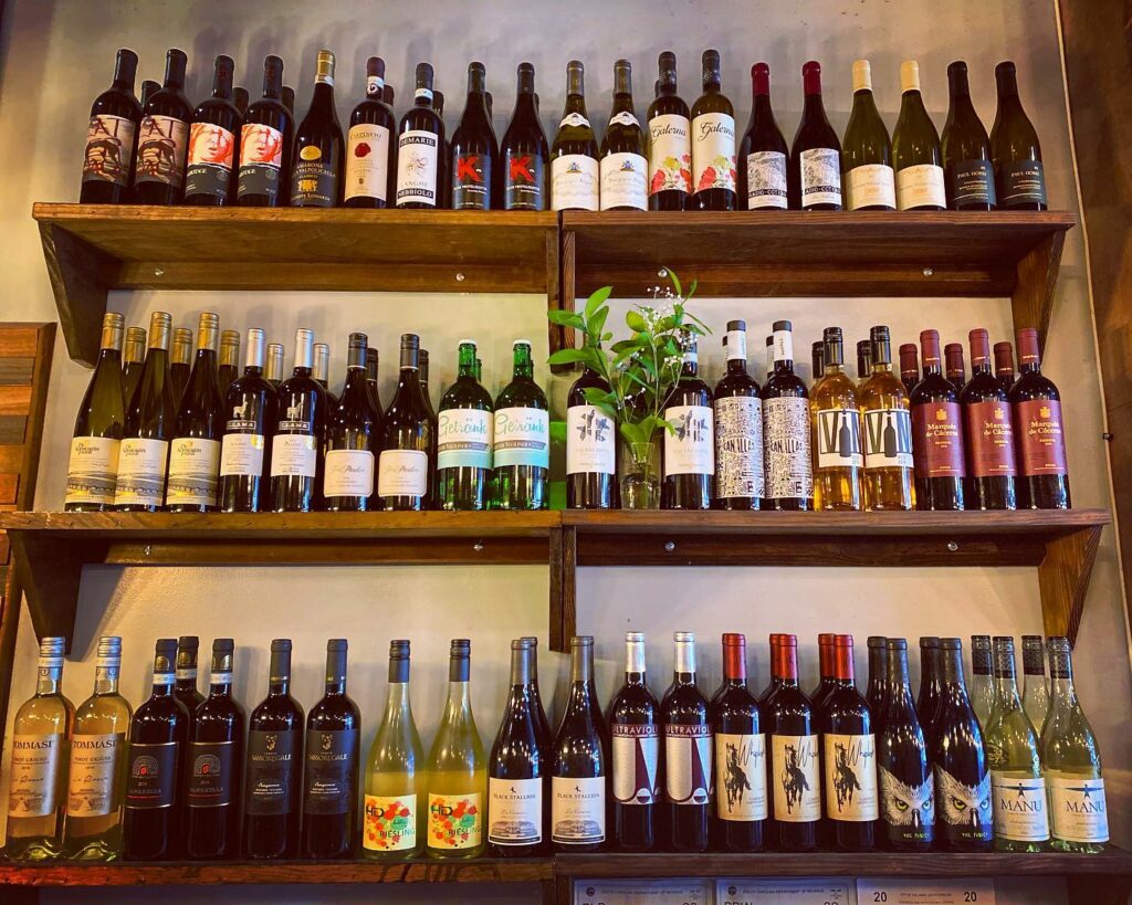 Shelfs with a large assortment of wine at 929 Kitchen and Bar
