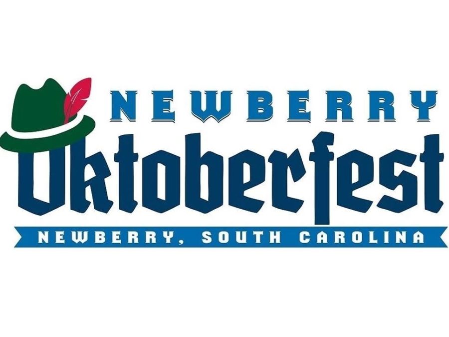 Newberry Oktoberfest Newberry, South Carolina blue and navy text with green Lederhosen with red feather perched on the capital O of Oktoberfest