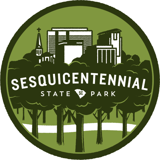 Sesquicentennial State Park SC green outline of the columbia cityscape with green trees covering and surrounding it all in a circle