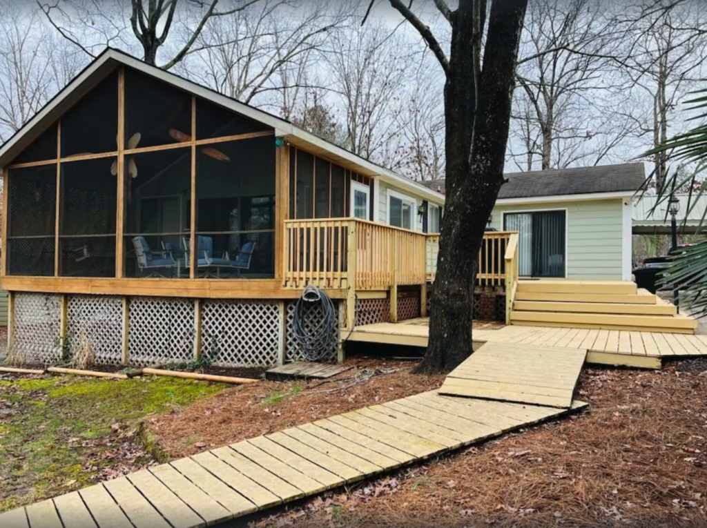 short term rental house with covered back deck and boardwalk to private dock