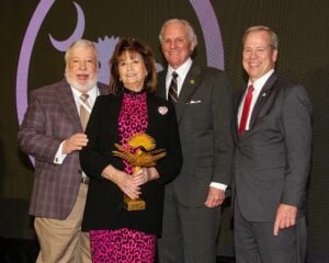 Miriam Atria holding Fred Brinkman Award standing with Buddy Jennings, Governor Henry McMaster, and SCPRT Director Duane Parrish