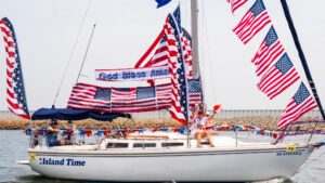 sail boat decorated in American flags