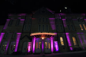 The Newberry Opera House lit up with eerie purple lights