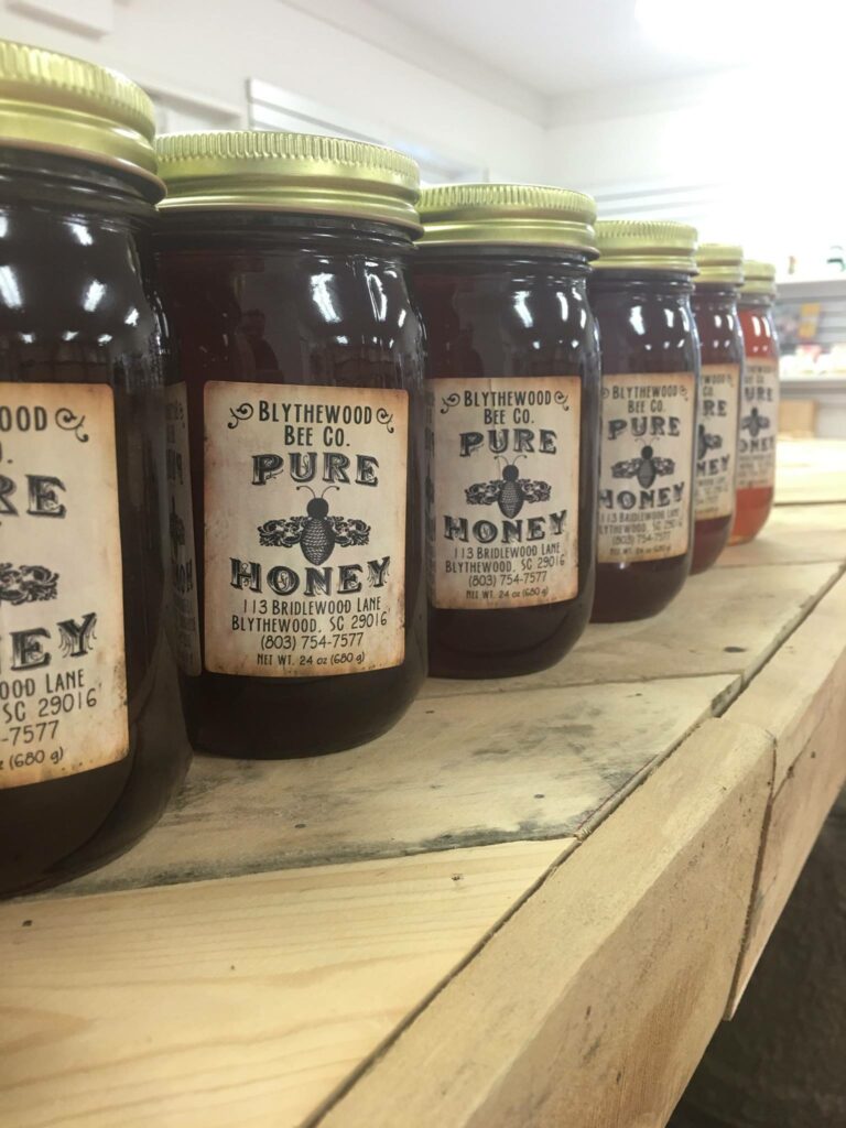Fresh honey in jars available for purchase from Blythewood Bee Company